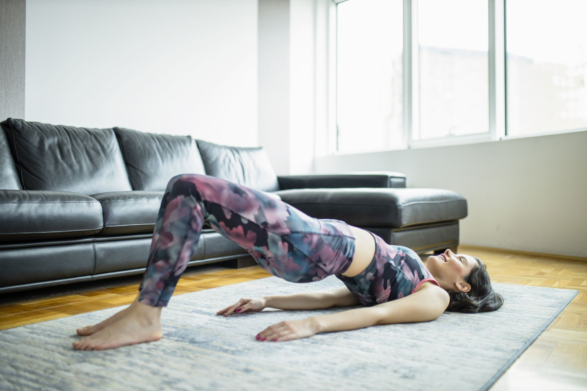 woman-practicing-yoga-doing-glute-bridge-exercise-royalty-free-image-1644350994